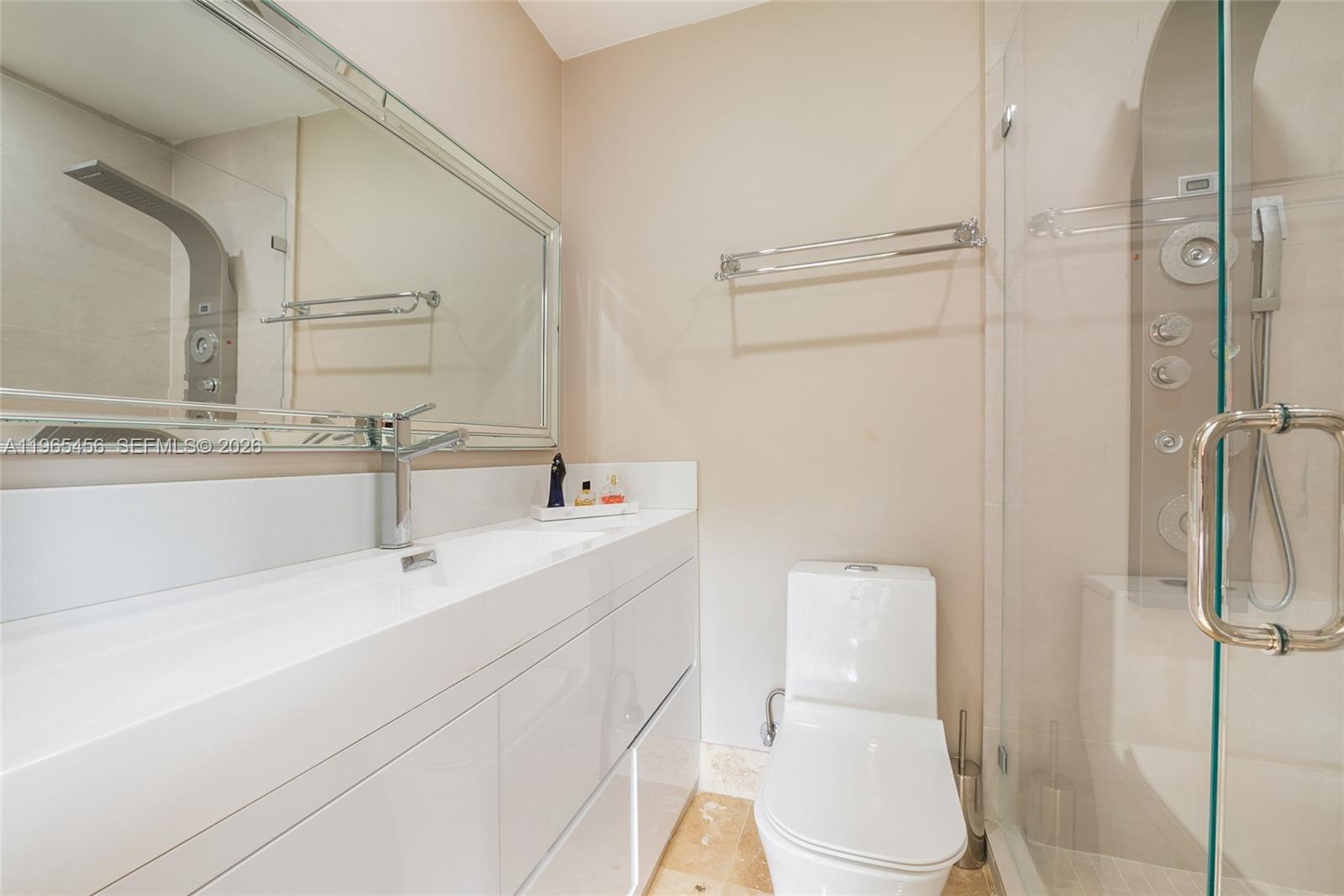 7401 Southwest 117th Street Pinecrest, FL 33156 - Photo 9 of 21 a bathroom with a sink a toilet and shower