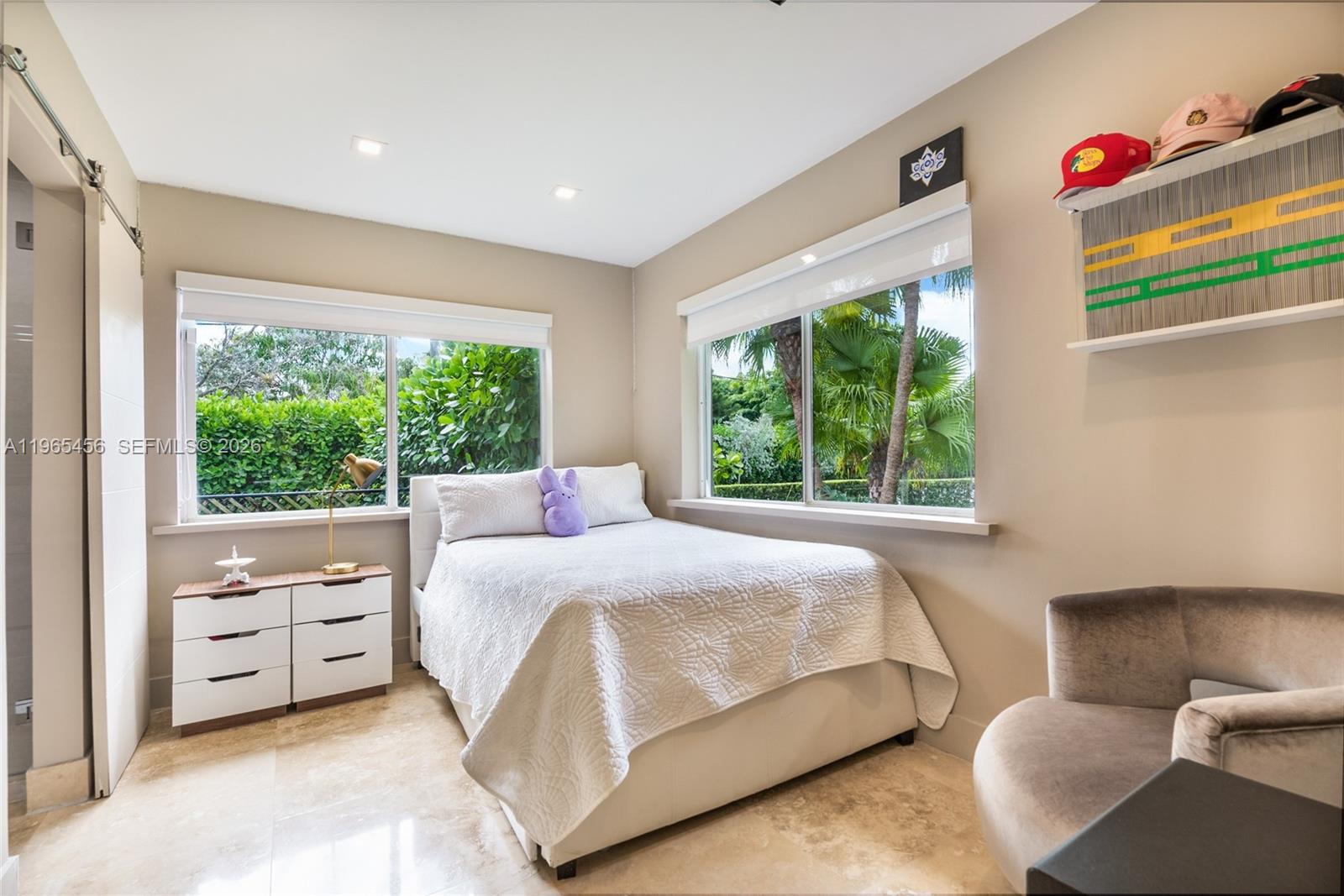 7401 Southwest 117th Street Pinecrest, FL 33156 - Photo 10 of 21 a bedroom with a bed and a window