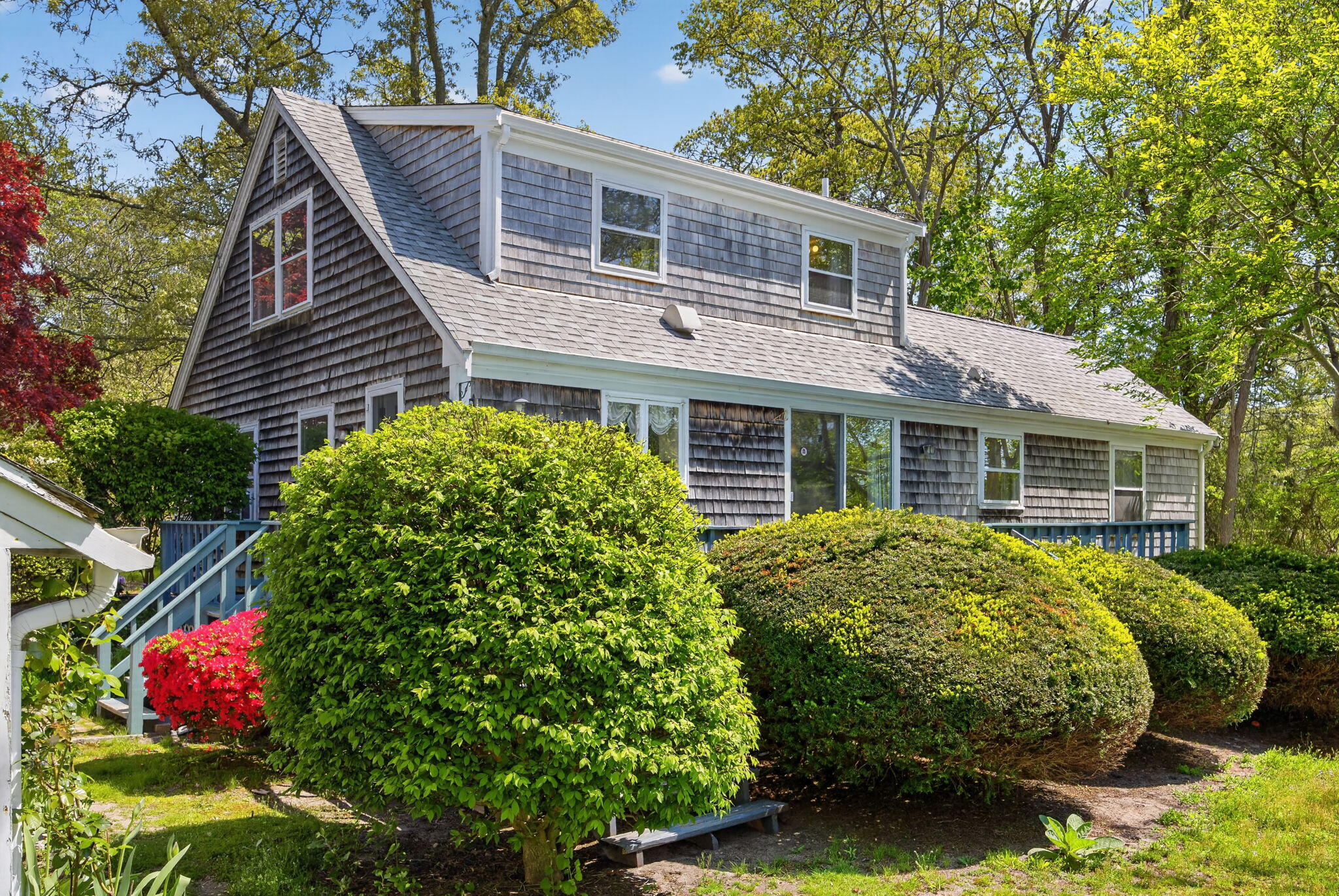 23 Nickerson Road Orleans, MA 02653 - Photo 31 of 54 a front view of a house with a garden