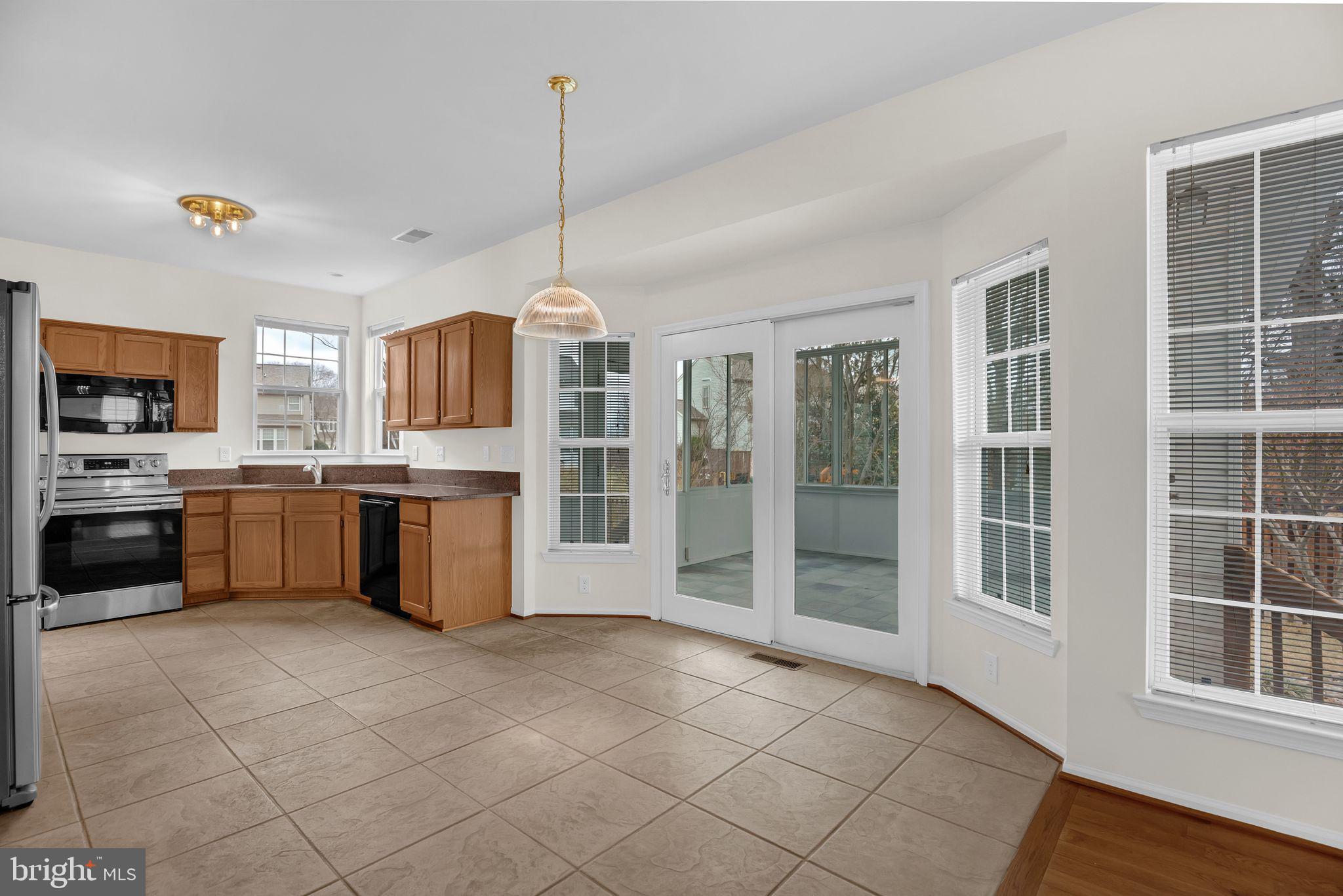 1557 Chapman Road Crofton, MD 21114 - Photo 11 of 39 Patio door leading to 3 seasons room.