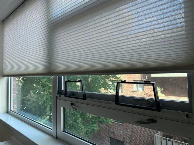 a view of a porch with wooden floor and outside space