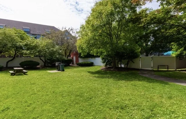 a view of backyard with a garden and entertaining space