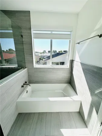 a bathroom with a shower and toilet