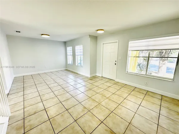 a view of an empty room and window