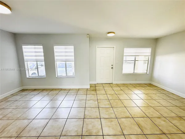 a view of an empty room and window