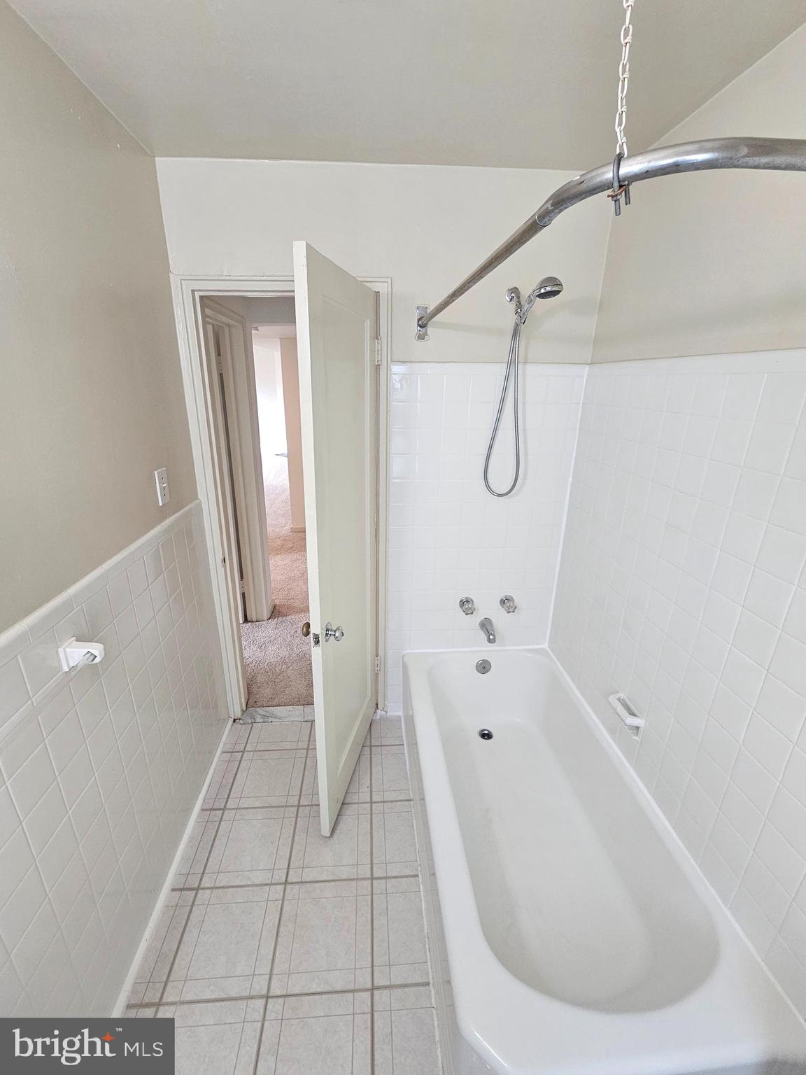2205 Washington Avenue, Unit 201 Silver Spring, MD 20910 - Photo 11 of 20 a bathroom with a bathtub and shower