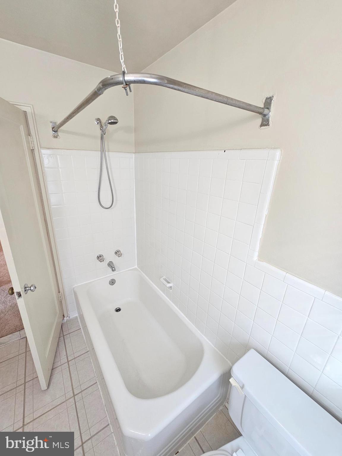 2205 Washington Avenue, Unit 201 Silver Spring, MD 20910 - Photo 12 of 20 a bathroom with a bathtub and a shower