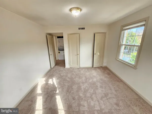 a view of empty room with windows