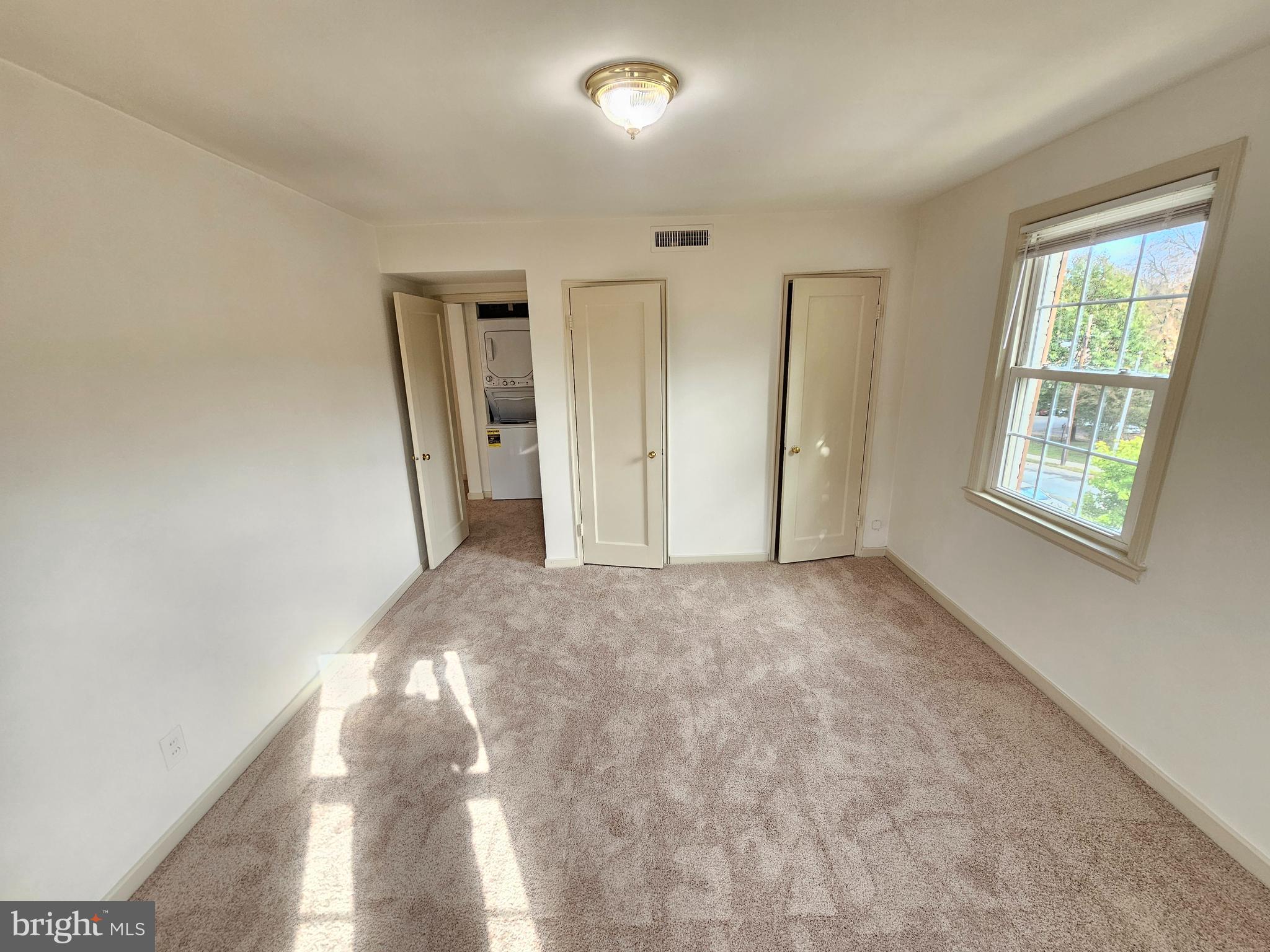 2205 Washington Avenue, Unit 201 Silver Spring, MD 20910 - Photo 13 of 20 a view of empty room with windows