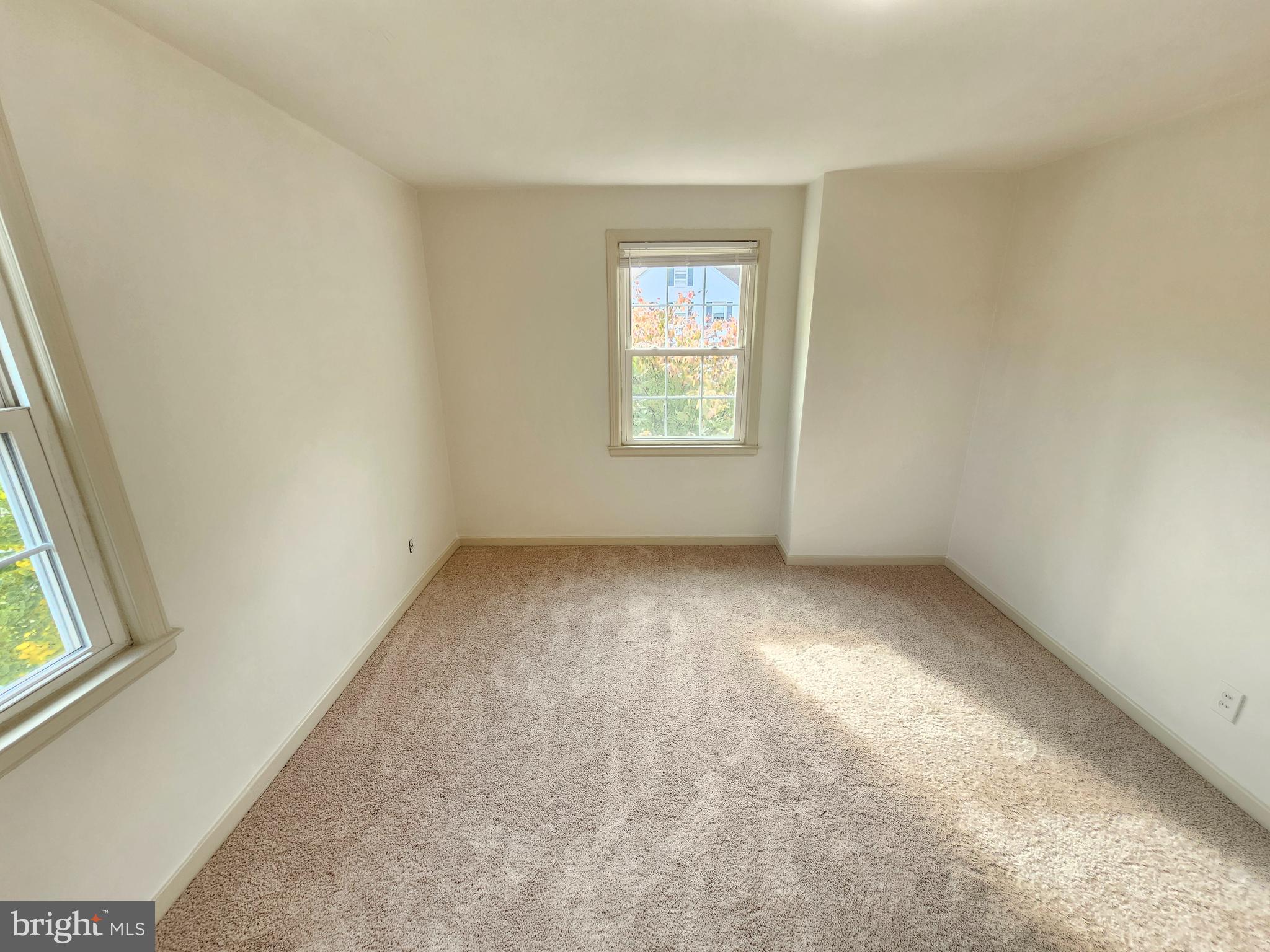 2205 Washington Avenue, Unit 201 Silver Spring, MD 20910 - Photo 14 of 20 an empty room with windows