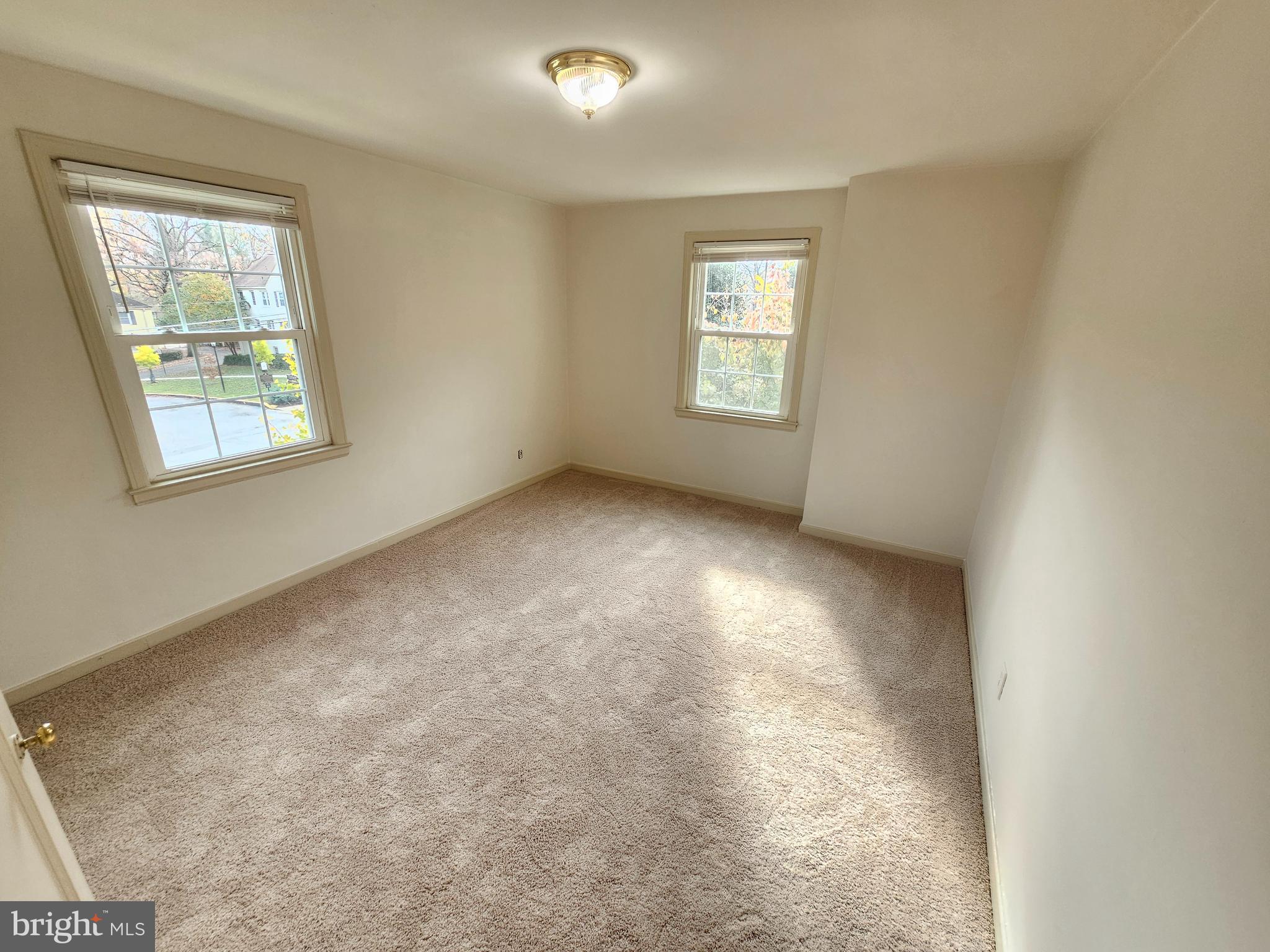 2205 Washington Avenue, Unit 201 Silver Spring, MD 20910 - Photo 15 of 20 an empty room with windows
