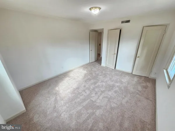 a view of room with window and stairs