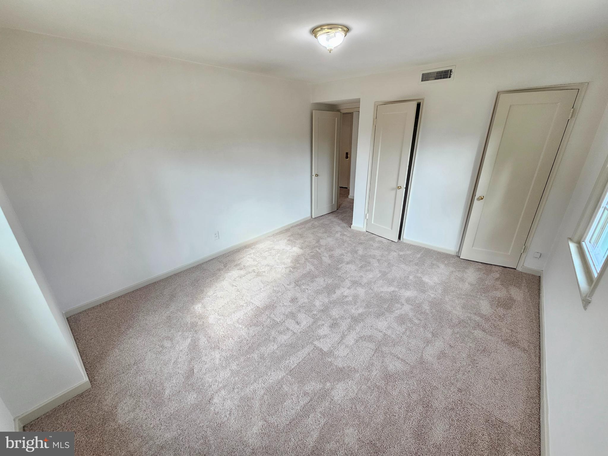 2205 Washington Avenue, Unit 201 Silver Spring, MD 20910 - Photo 16 of 20 a view of room with window and stairs