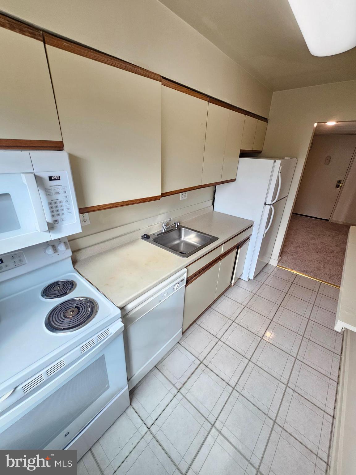 2205 Washington Avenue, Unit 201 Silver Spring, MD 20910 - Photo 6 of 20 a kitchen with a sink and cabinets