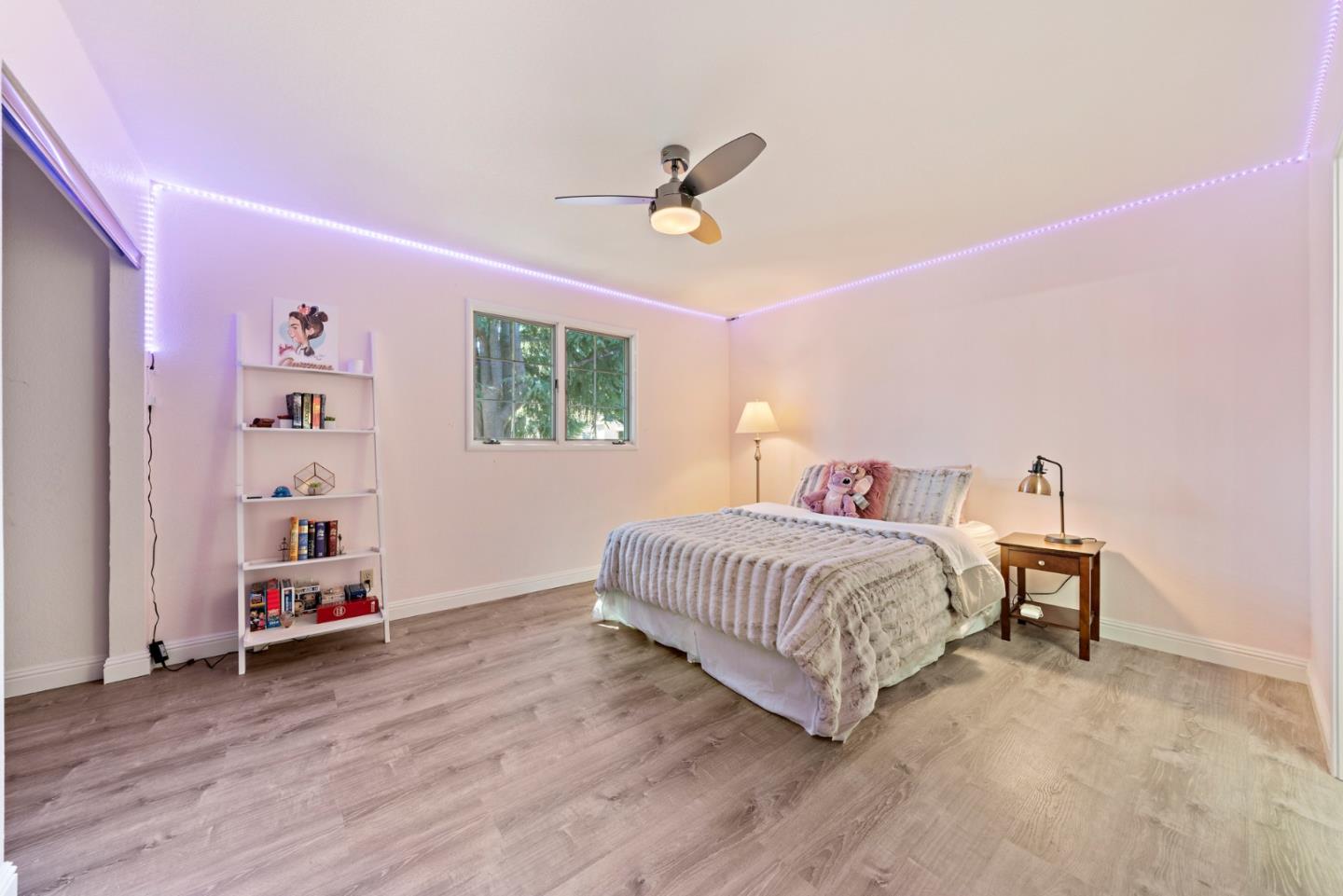 145 Redding Road Campbell, CA 95008 - Photo 17 of 22 a bedroom with a bed and a chandelier