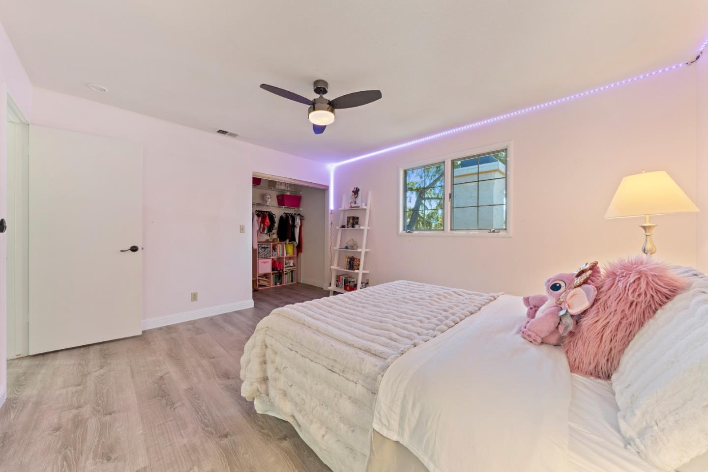145 Redding Road Campbell, CA 95008 - Photo 18 of 22 a bedroom with a large bed and a chandelier