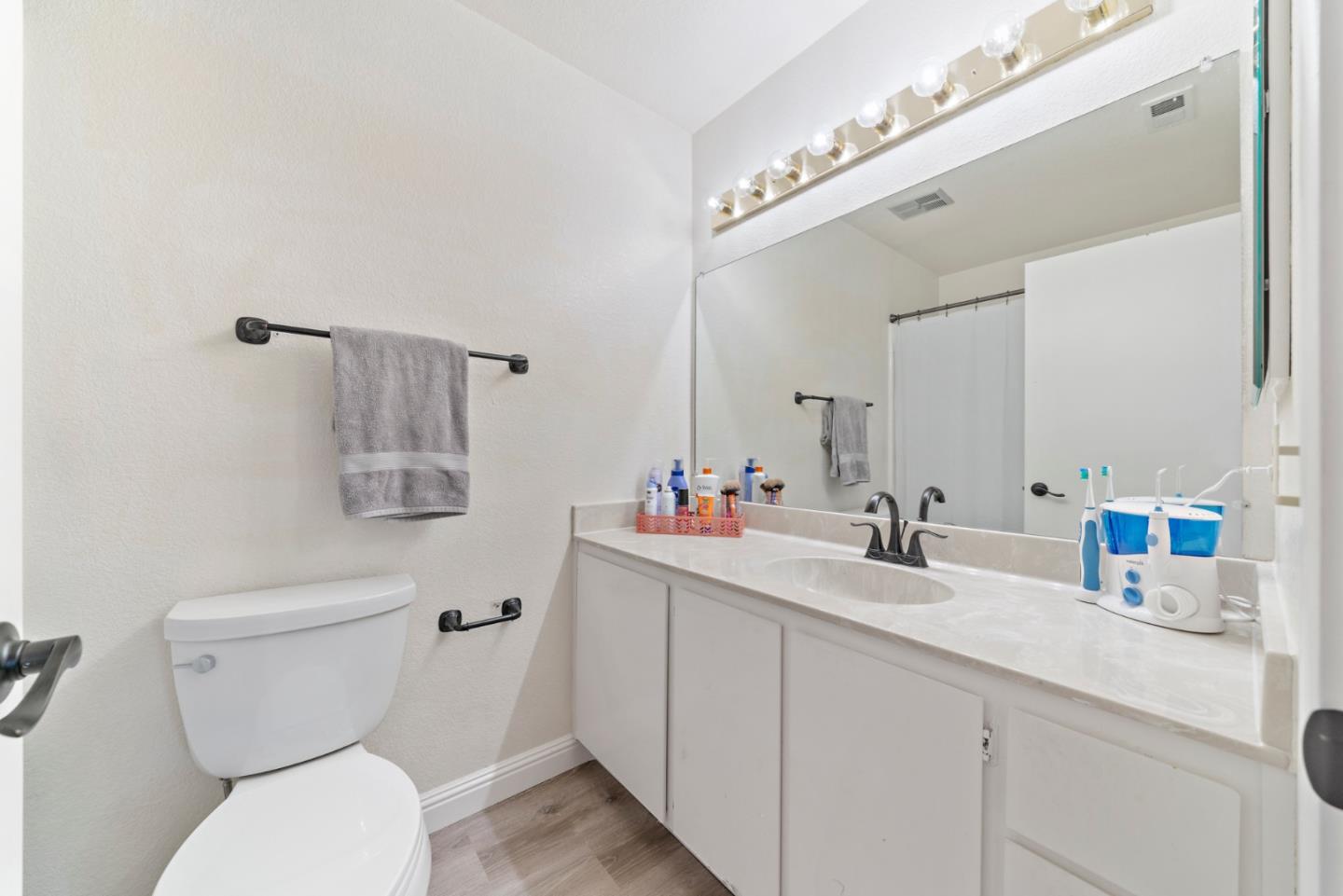 145 Redding Road Campbell, CA 95008 - Photo 19 of 22 a bathroom with a toilet sink and mirror