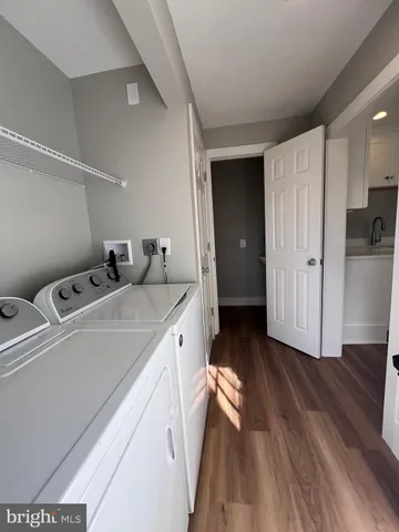 a kitchen with a refrigerator and a stove