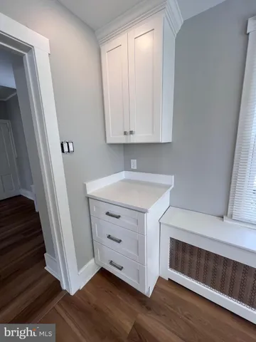 a view of an entryway with wooden floor