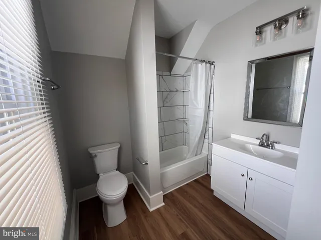 a bathroom with a toilet sink and tub