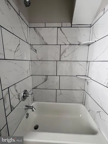 a bathroom with a bathtub