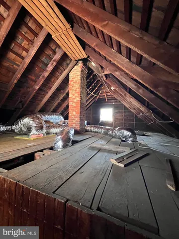 a view of a patio with table and chairs with wooden floor