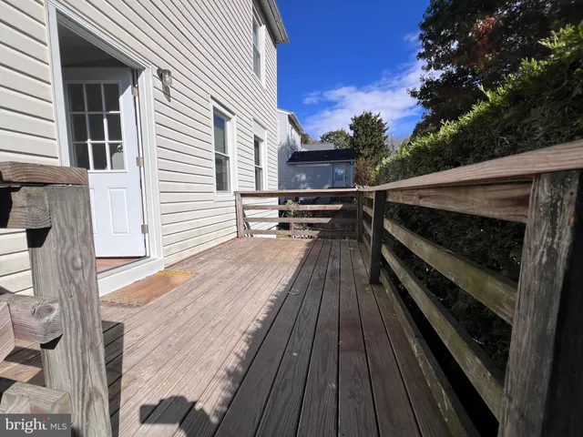 a view of outdoor space with wooden floor and electric light