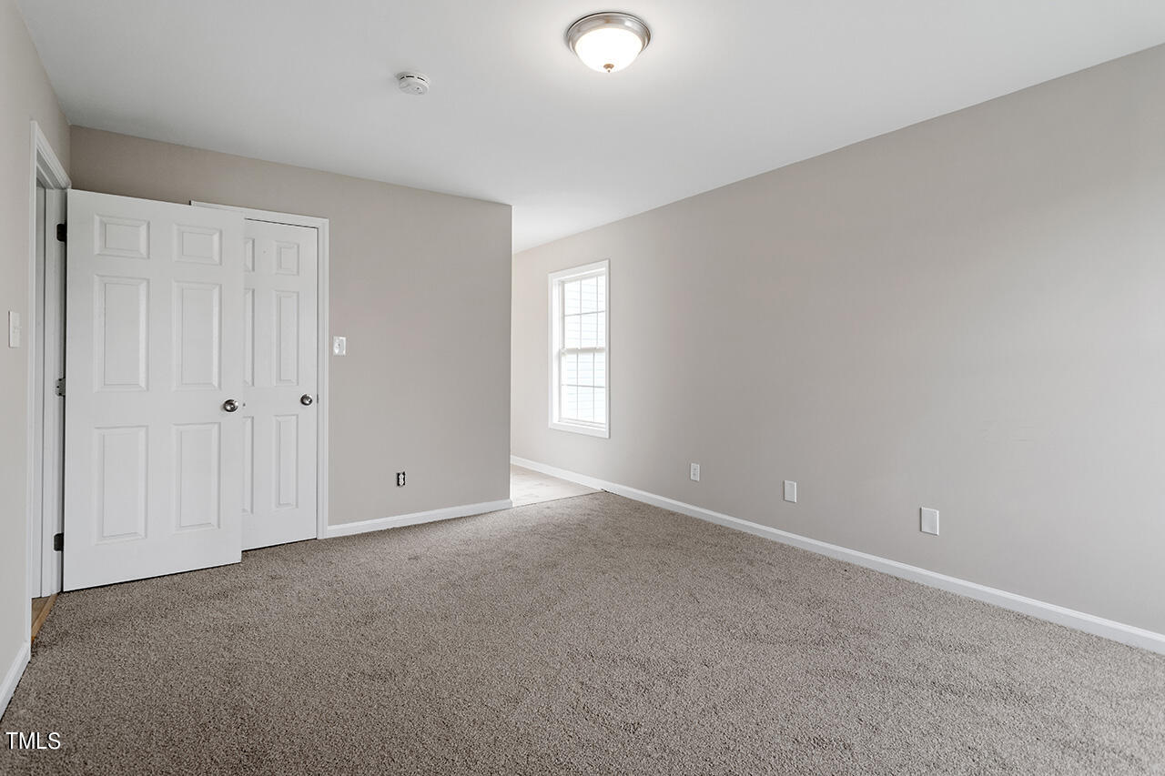 2127 Bainbridge Road Stedman, NC 28391 - Photo 14 of 27 a view of an empty room and window