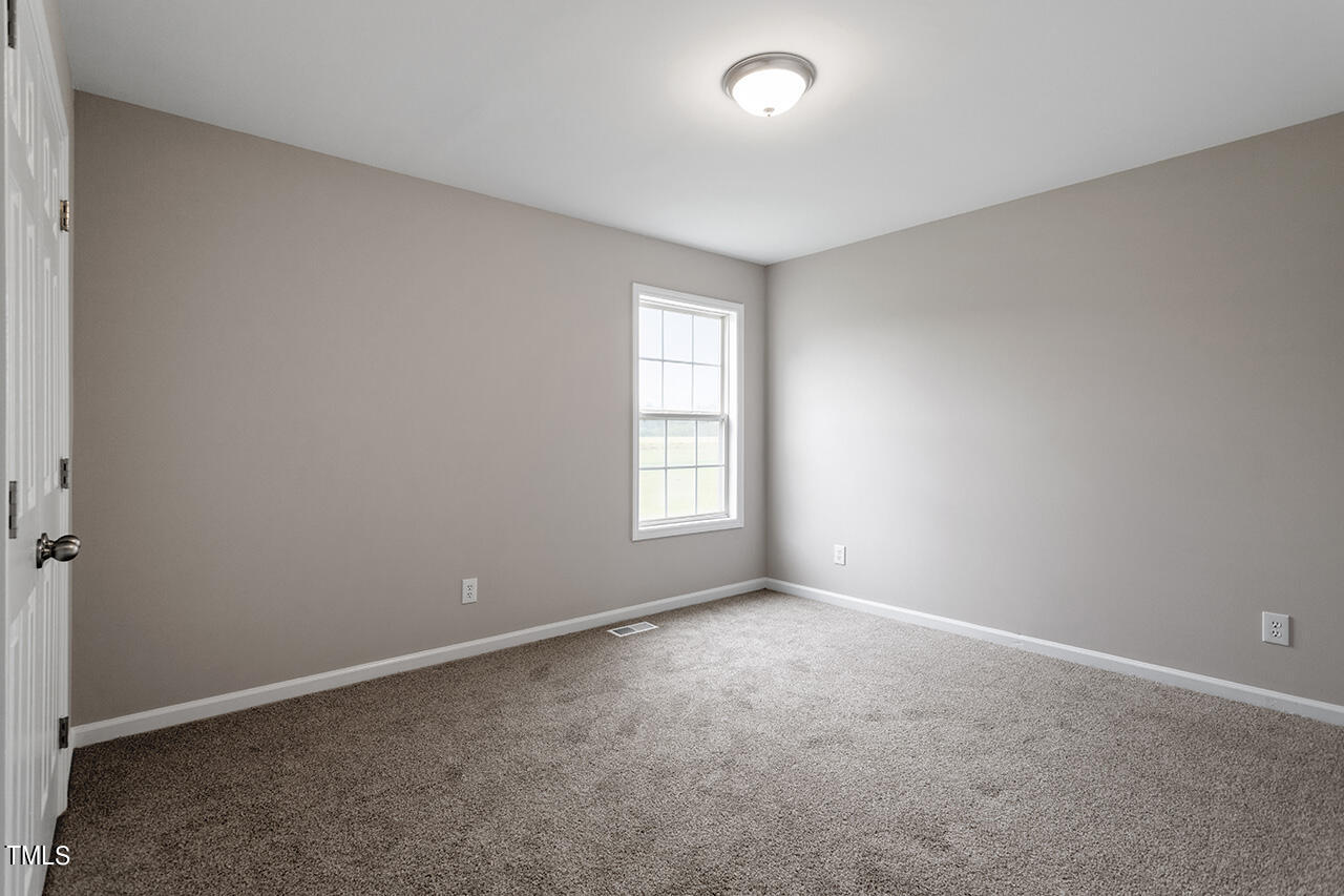 2127 Bainbridge Road Stedman, NC 28391 - Photo 20 of 27 an empty room with windows