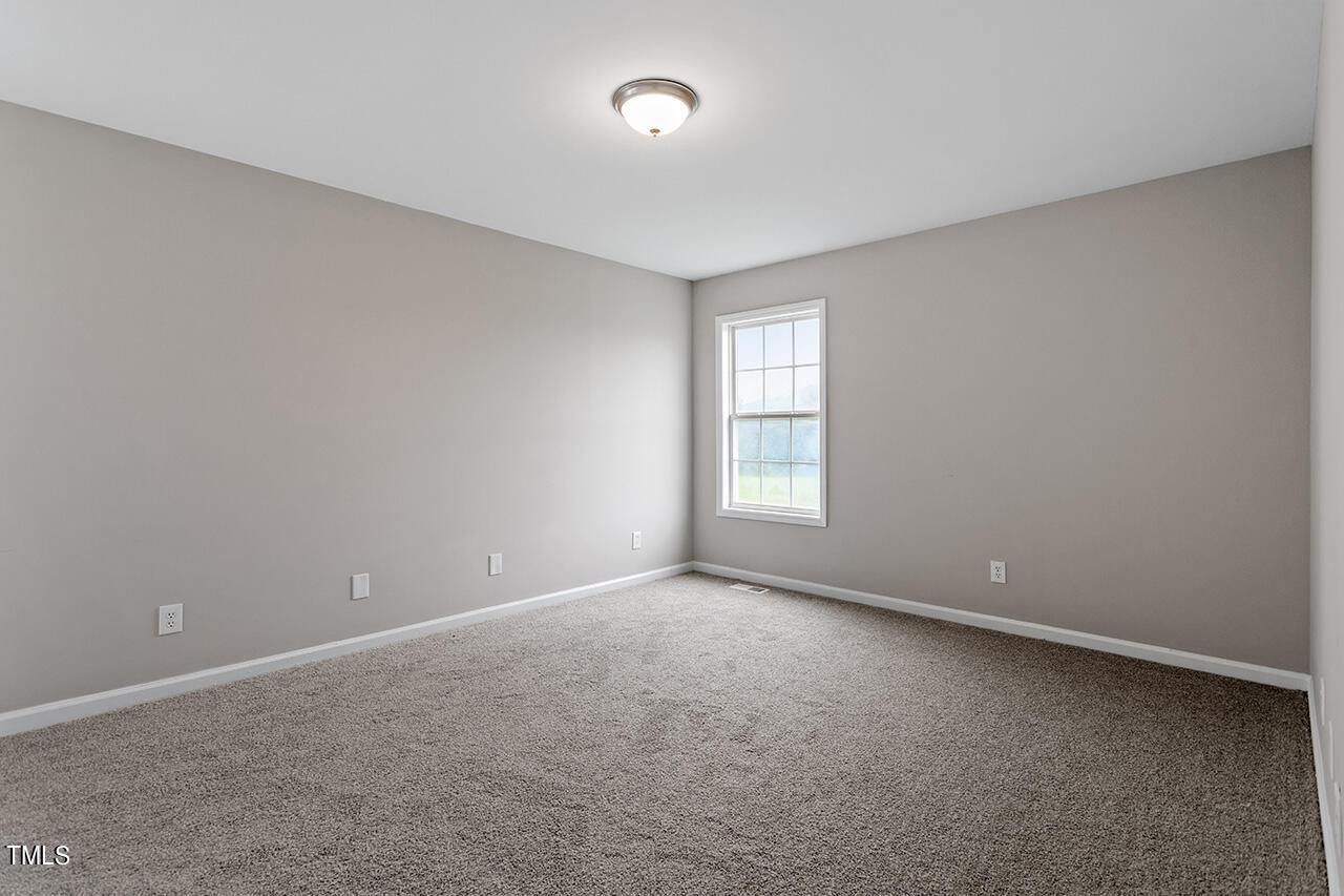 2127 Bainbridge Road Stedman, NC 28391 - Photo 22 of 27 a view of an empty room with a window
