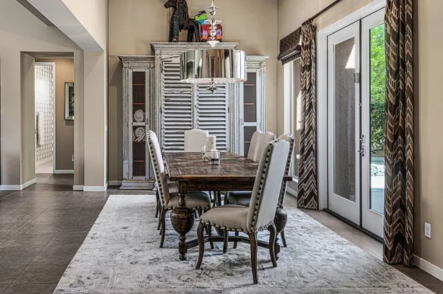 a dining room with furniture and window