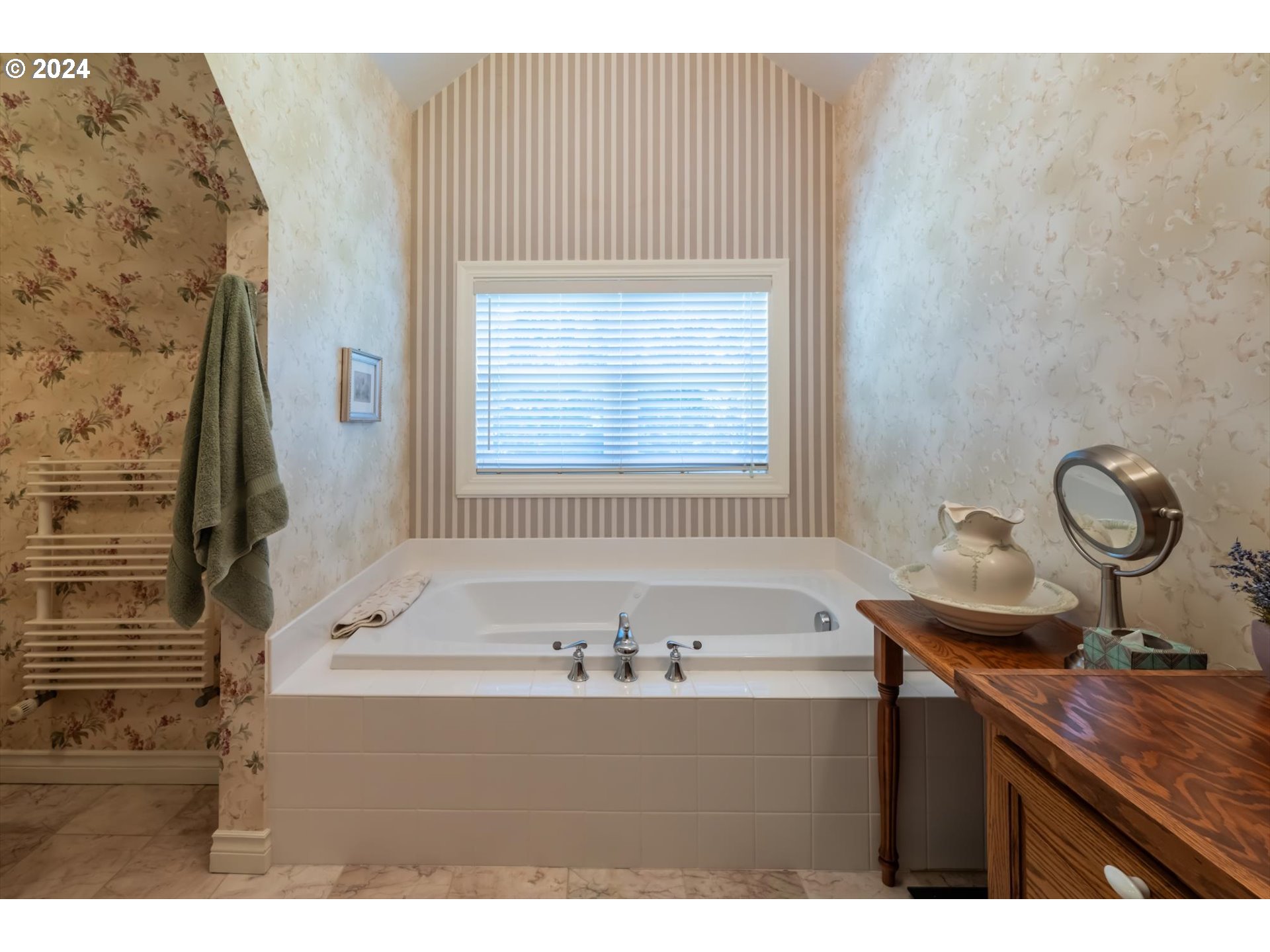 54980 Morrison Road Bandon, OR 97411 - Photo 11 of 48 a bathroom with a sink and a bathtub
