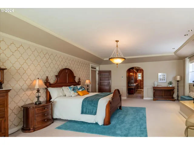 a bedroom with a bed and a fireplace