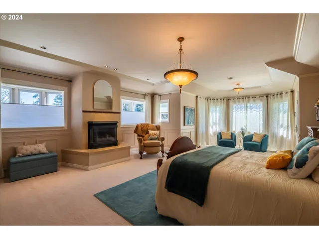 a living room with furniture fireplace and a window