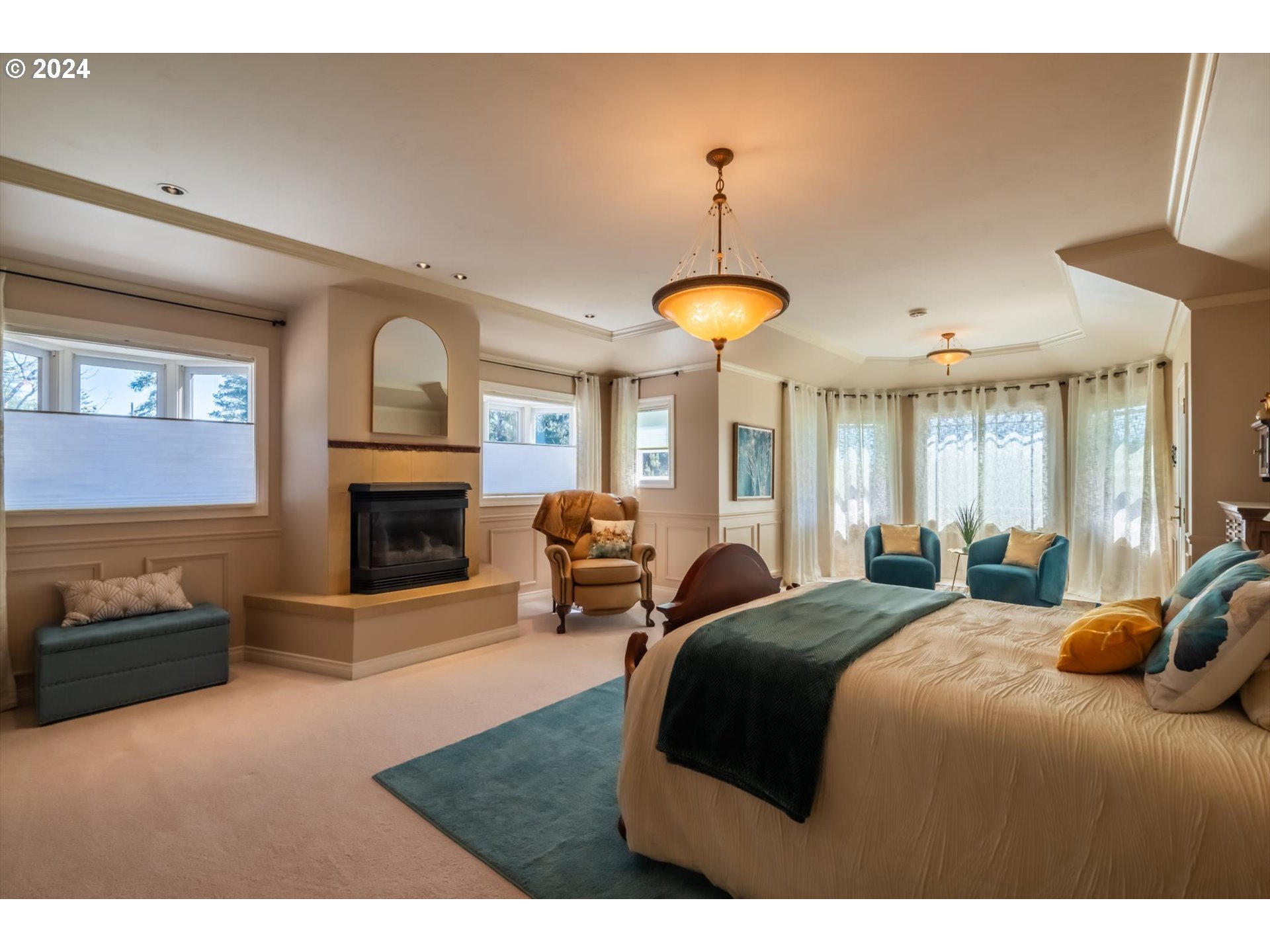 54980 Morrison Road Bandon, OR 97411 - Photo 22 of 48 a bedroom with a bed and a fireplace