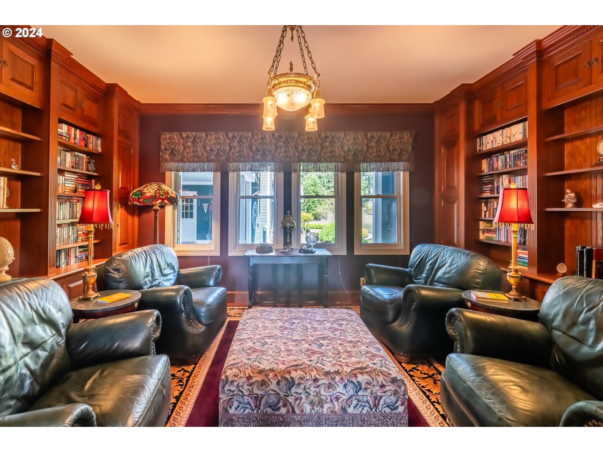 54980 Morrison Road Bandon, OR 97411 - Photo 24 of 48 a living room with furniture a lamp and a chandelier
