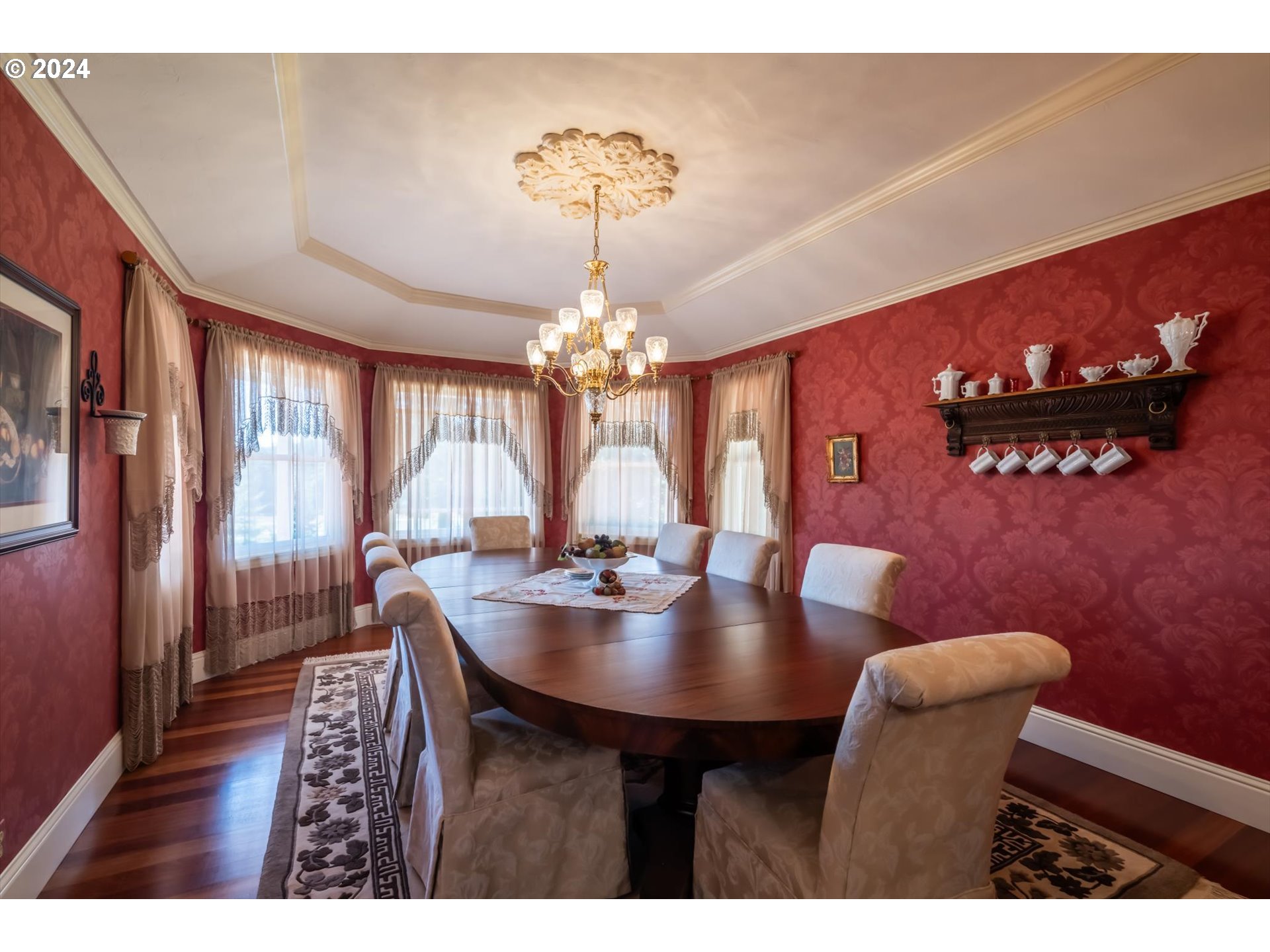 54980 Morrison Road Bandon, OR 97411 - Photo 30 of 48 a view of a dining room with furniture and chandelier