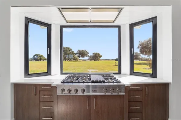 a view of livingroom with furniture wooden floor and windows