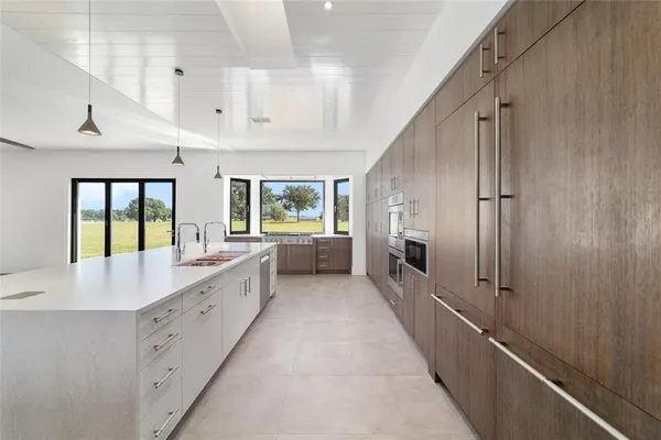 a kitchen with a sink and cabinets