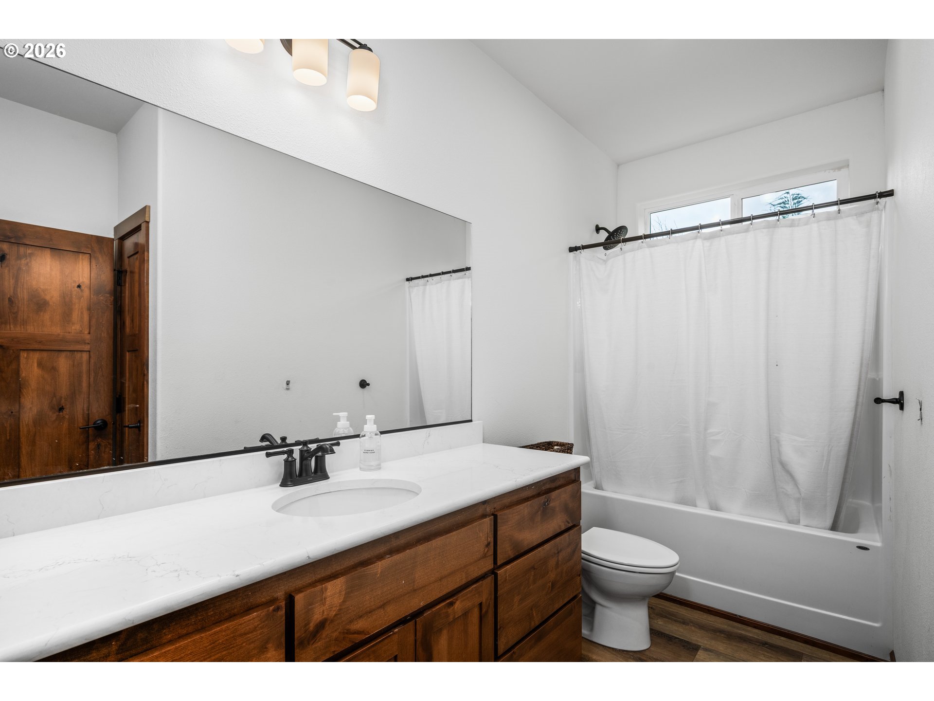 45542 South Gate Creek Road Vida, OR 97488 - Photo 14 of 46 a bathroom with a sink a toilet a mirror and shower