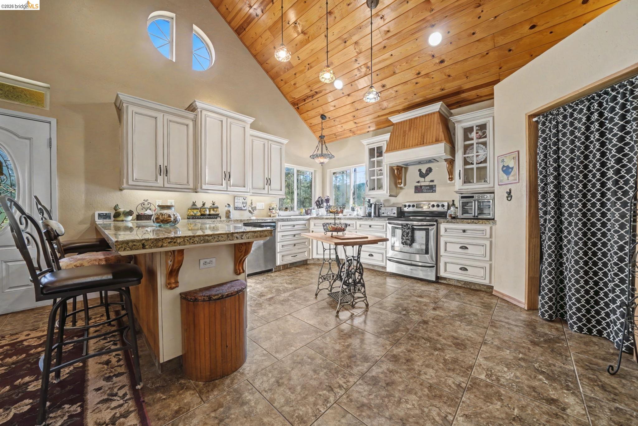 6145 Swiss Ranch Road Mountain Ranch, CA 95246 - Photo 13 of 60 a open kitchen that has a lot of cabinets refrigerator oven and a sink