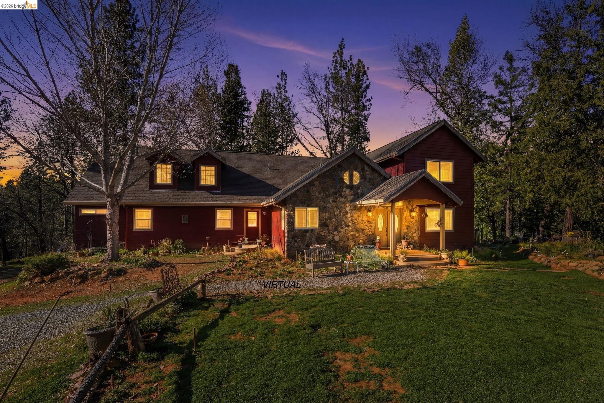 6145 Swiss Ranch Road Mountain Ranch, CA 95246 - Photo 2 of 60 a front view of a house with a yard