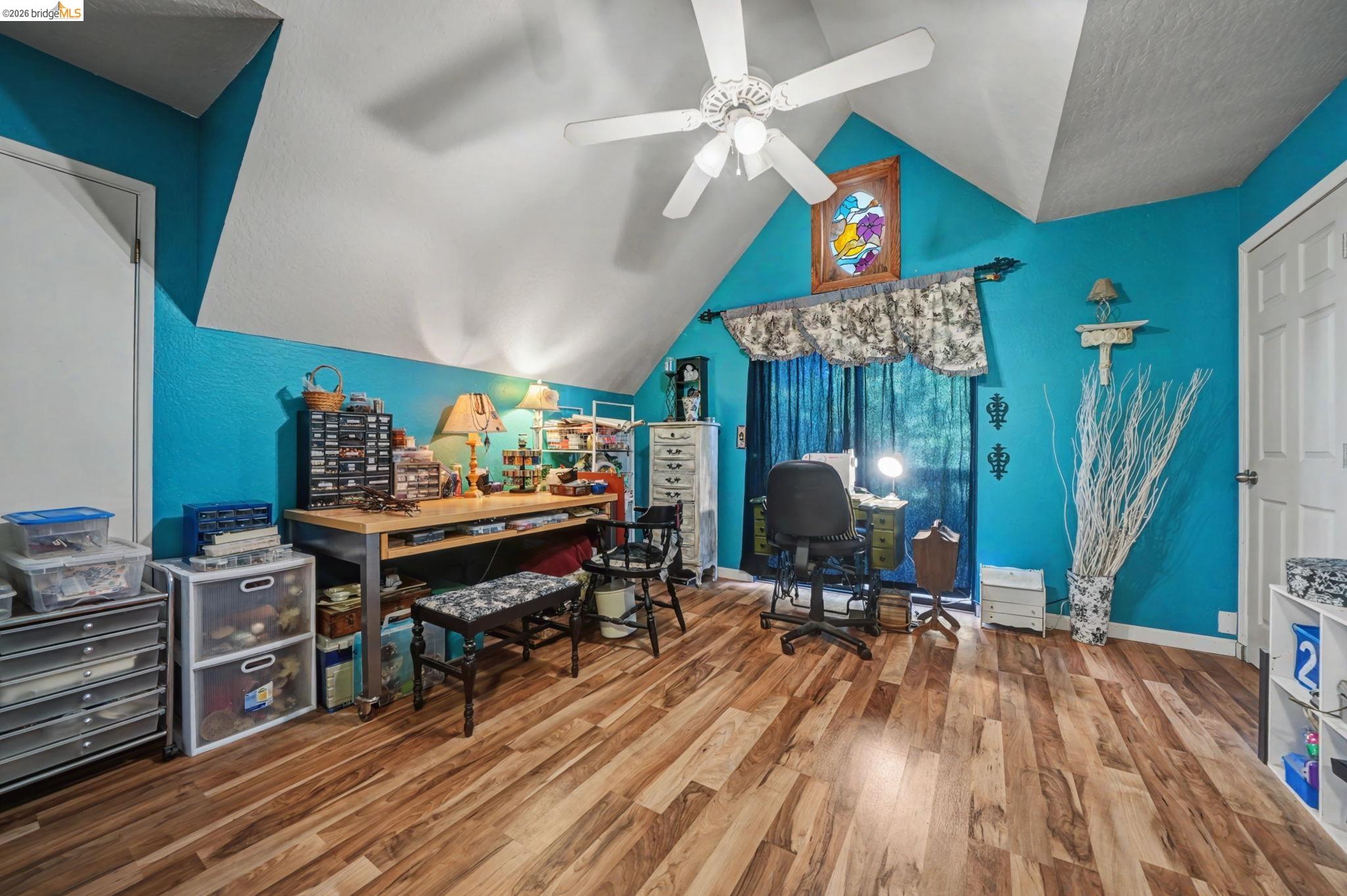 6145 Swiss Ranch Road Mountain Ranch, CA 95246 - Photo 48 of 60 a living room filled with furniture and a wooden floor