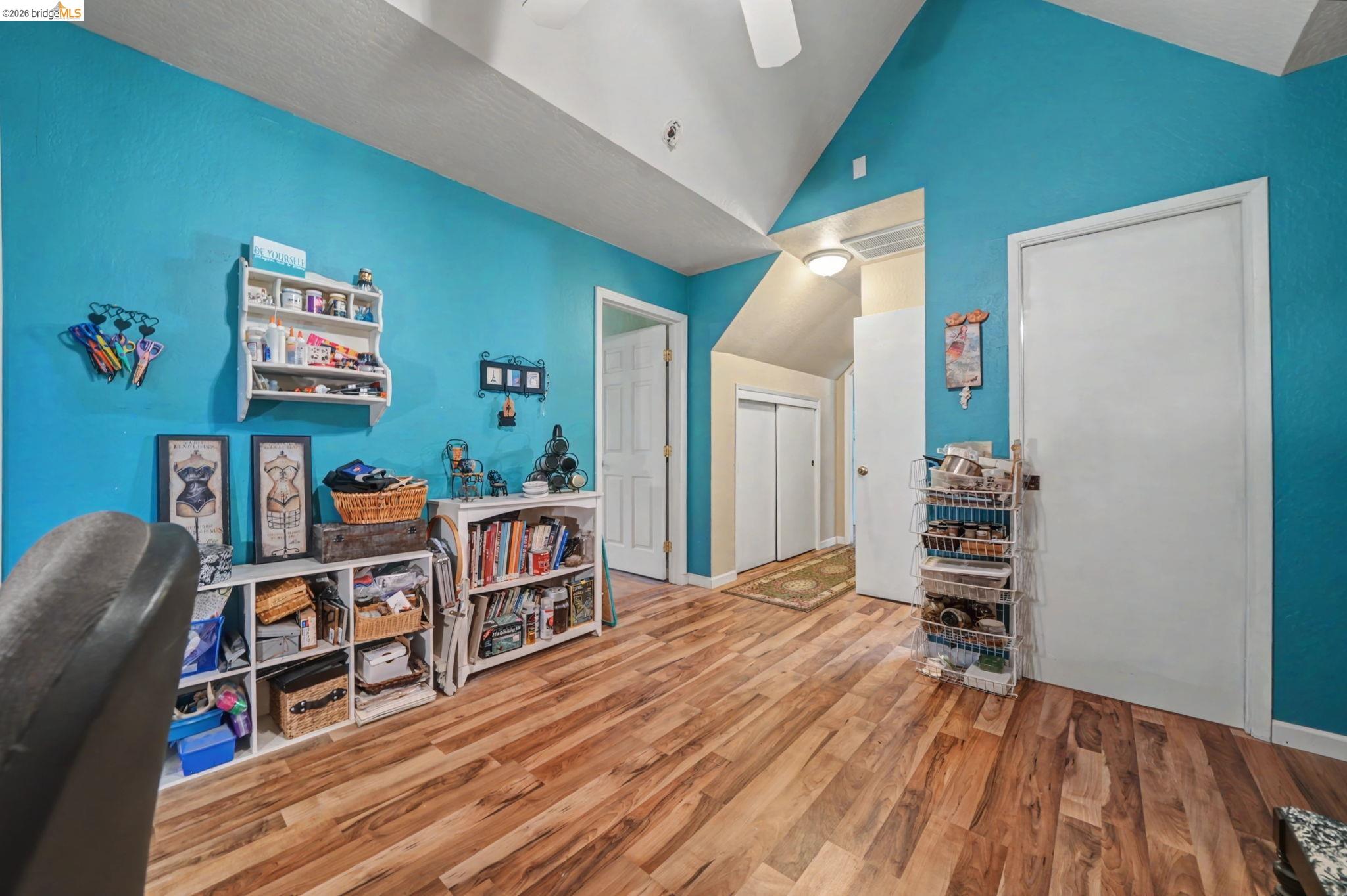 6145 Swiss Ranch Road Mountain Ranch, CA 95246 - Photo 49 of 60 Playroom featuring vaulted ceiling, light wood-style floors, and a ceiling fan