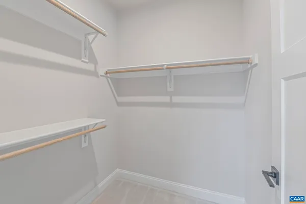 a view of an empty walk in closet