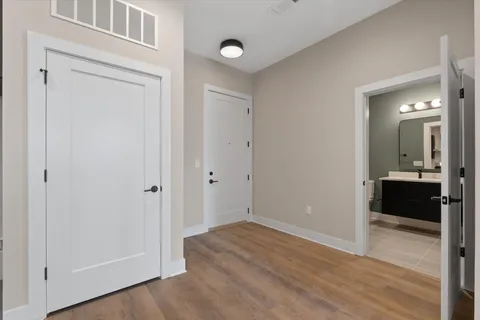 a view of a bathroom from a hallway