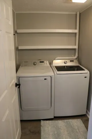 a utility room with washer and dryer