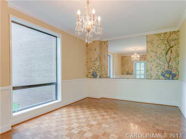 808 Cherokee Road, Unit J1 Charlotte, NC 28207 - Photo 4 of 16 a view of a big room with windows and chandelier