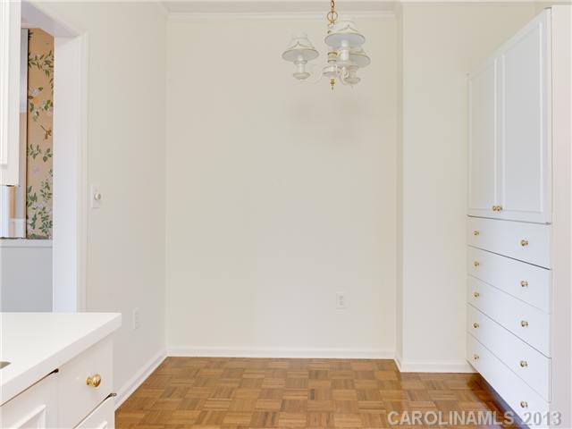 808 Cherokee Road, Unit J1 Charlotte, NC 28207 - Photo 7 of 16 a view of a room with white cabinets