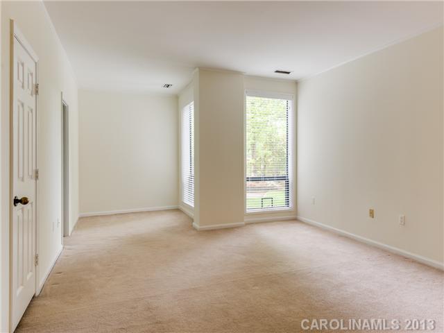 808 Cherokee Road, Unit J1 Charlotte, NC 28207 - Photo 8 of 16 a view of an empty room with a window
